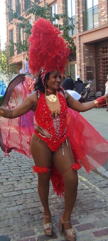 Carnival masquerader in red costume