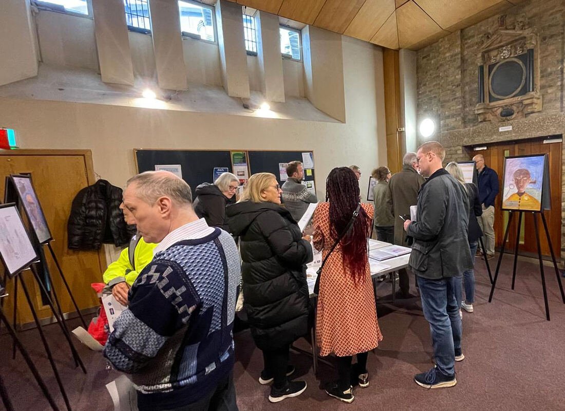 Written in the Records exhibition with visitors viewing student artwork